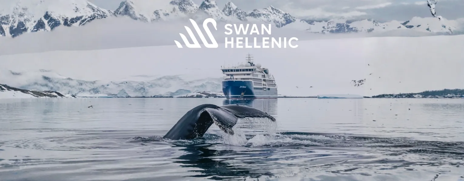 Swan Hellenic SH Minerva expedition ship sailing near icebergs in Antarctica